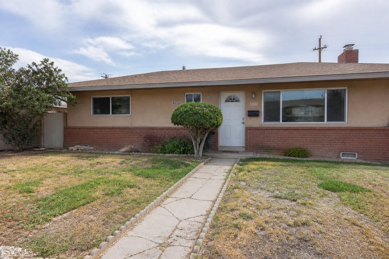 Dated suburban ranch house before AI exterior redesign