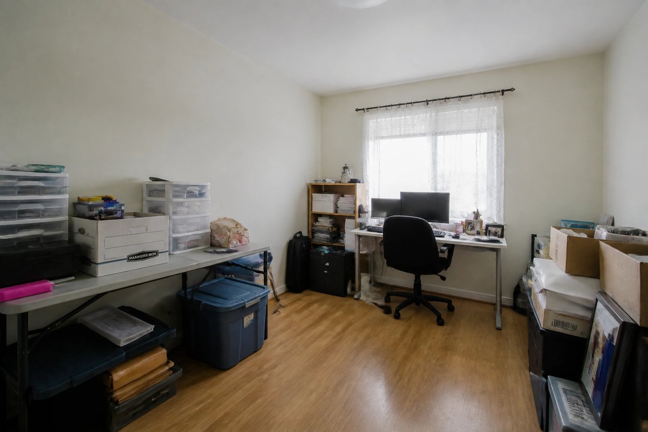 Plain spare-room home office before AI redesign