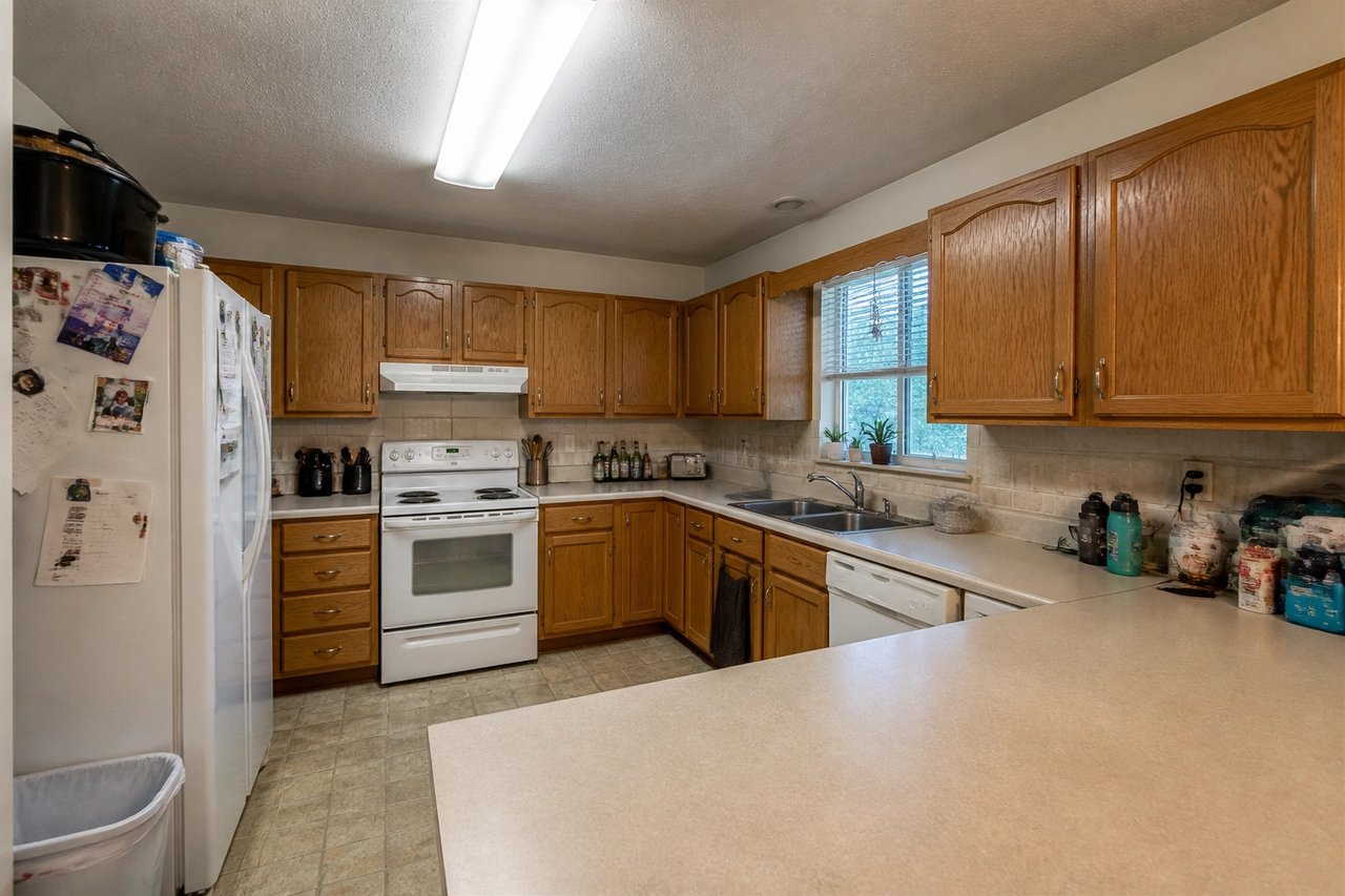 Dated oak kitchen before AI remodel