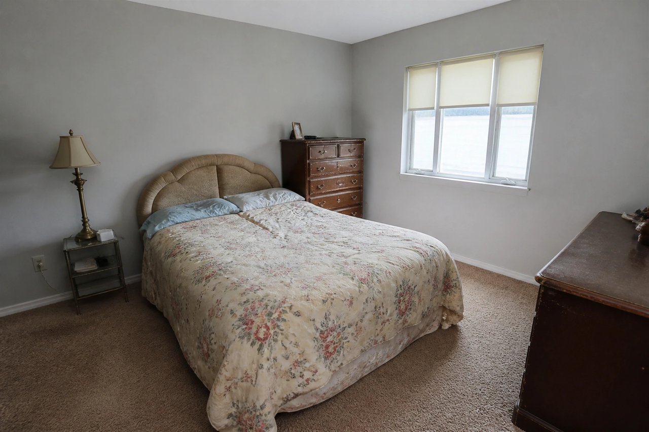 Bedroom with old mismatched furniture before AI replacement