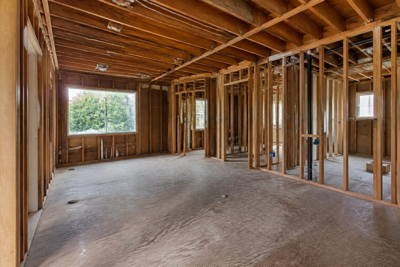 Gutted living space under construction before AI finish