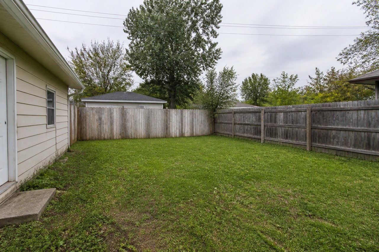 Plain bare backyard before AI garden design